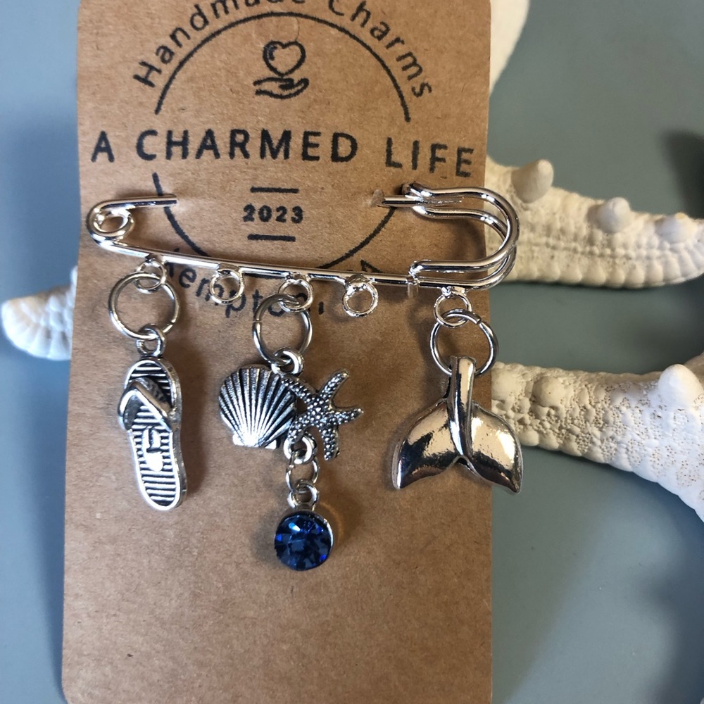NWT, Handmade by A Charmed Life. Silver Pin with Ocean Themed Silver Charms